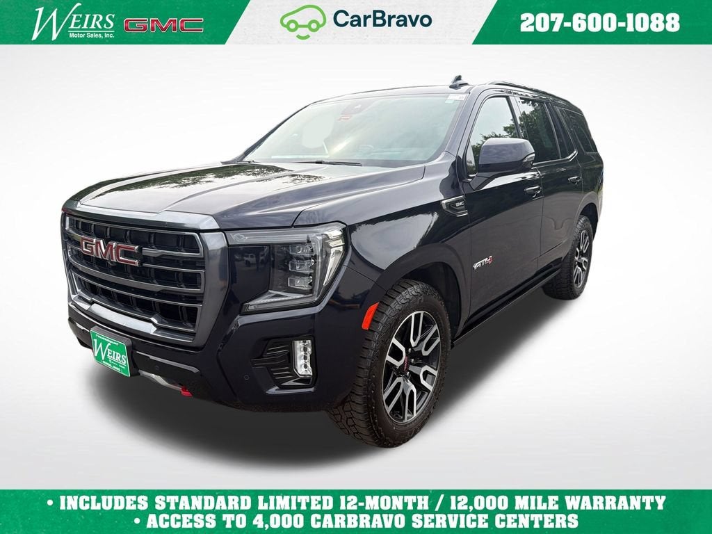 2023 GMC Yukon AT4 in Midnight Blue Metallic — front three-quarter view