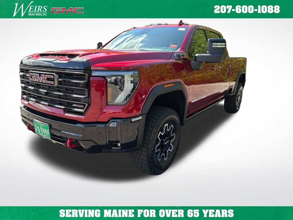 2026 GMC Sierra 2500 HD AT4X in Volcanic Red Tintcoat — front three-quarter view